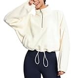 THE GYM PEOPLE Women’s Half Zip Crop Pullover Sweatshirt Fleece Stand Collar Workout Tops with Pockets Drawstring Hem Beige