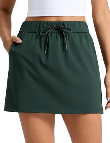 CRZ YOGA 4-Way Stretch A Line Skirts for Women - High Waitsted Mini Lined Tennis Work Drawstring Skort with Pockets Legend Green Medium