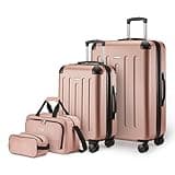 Amazon Basics 4-Piece Luggage Set, Including Two Hardside Suitcases With Multi-directional Spinner Wheels (22" Carry-On and 28" Checked), 15" Tote Bag and 10" Compact Travel Bag, Rose Gold